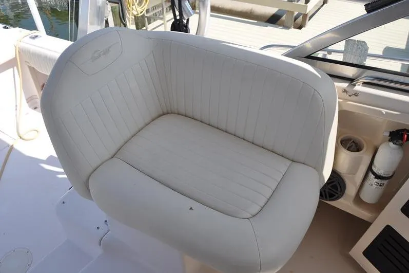 Slide: The Image of White cushioned seat on 2010 Grady-White Chesapeake 290 boat deck. - 22
