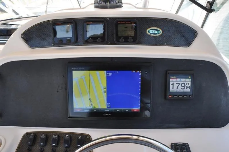 Slide: The Image of Dashboard of 2010 Grady-White Chesapeake 290 boat with navigation instruments. - 24