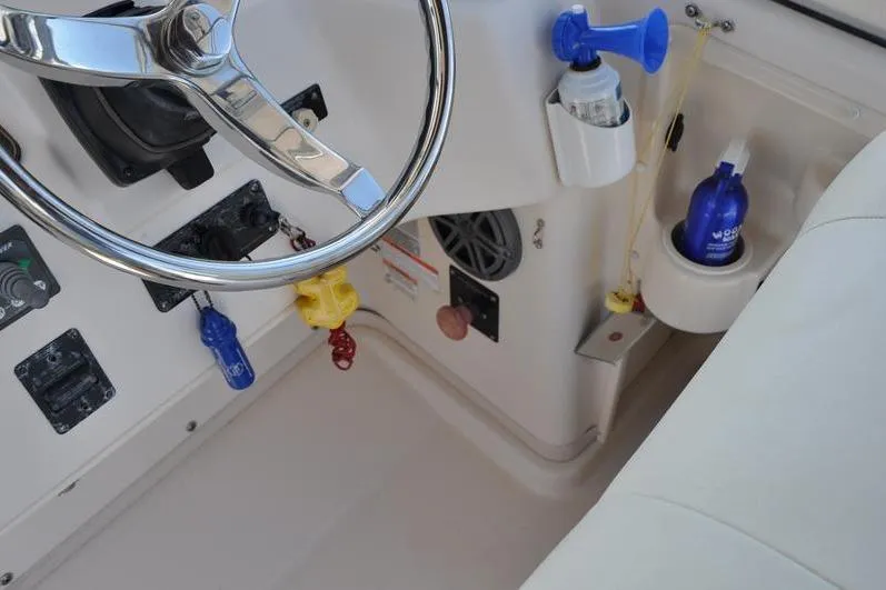 Slide: The Image of Interior of 2010 Grady-White Chesapeake 290 boat showing steering wheel and controls. - 29