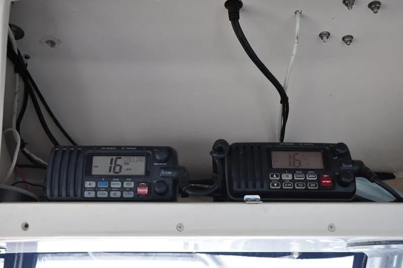Slide: The Image of VHF radios on 2010 Grady-White Chesapeake 290 boat dashboard. - 30