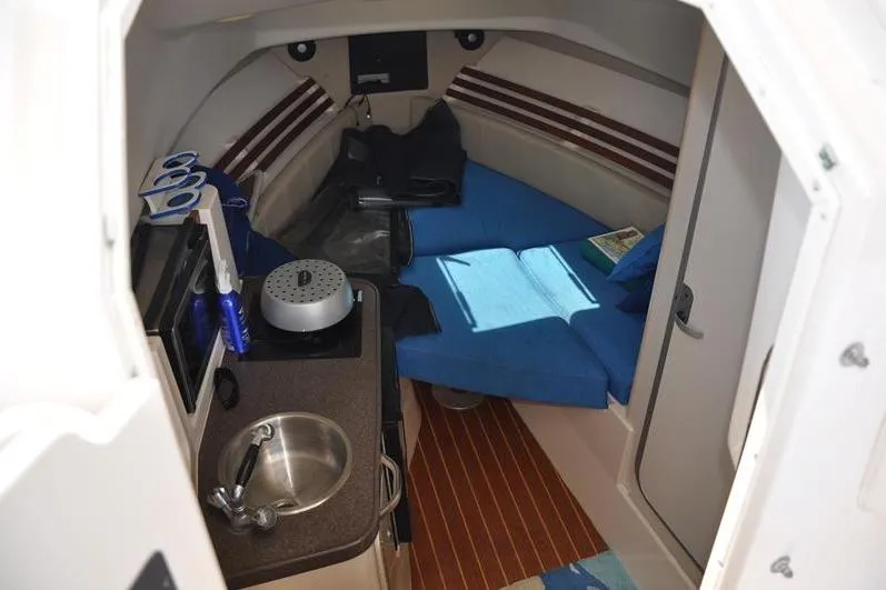 Slide: The Image of Interior of 2010 Grady-White Chesapeake 290 boat with cozy seating and kitchenette. - 31