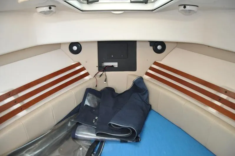 Slide: The Image of Interior cabin of 2010 Grady-White Chesapeake 290 boat, featuring seating and storage. - 32