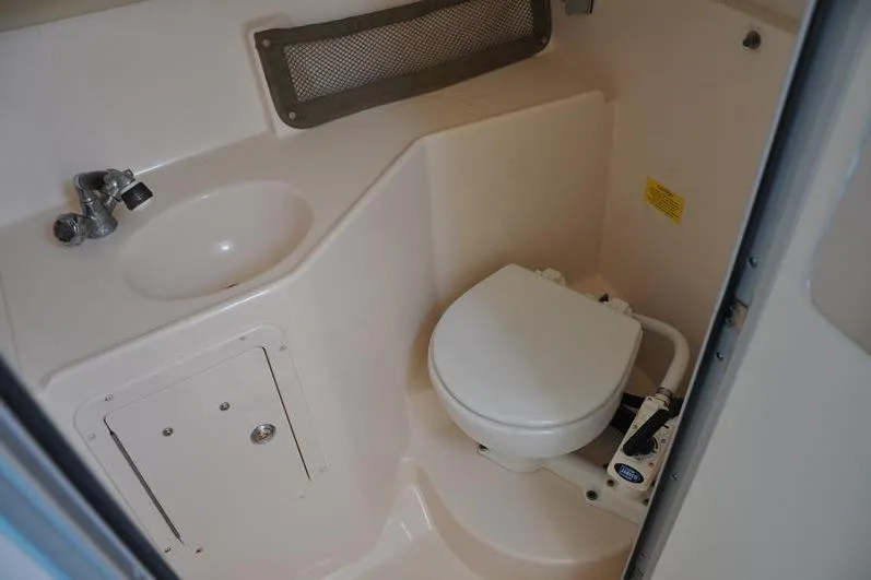 Slide: The Image of 2010 Grady-White Chesapeake 290 boat bathroom with sink and toilet. - 35