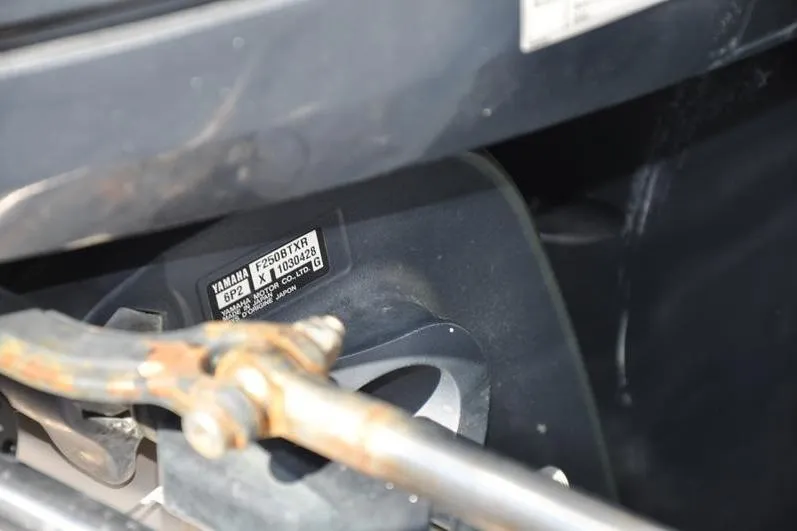 Slide: The Image of Close-up of a Yamaha engine part on a 2010 Grady-White Chesapeake 290 boat. - 39