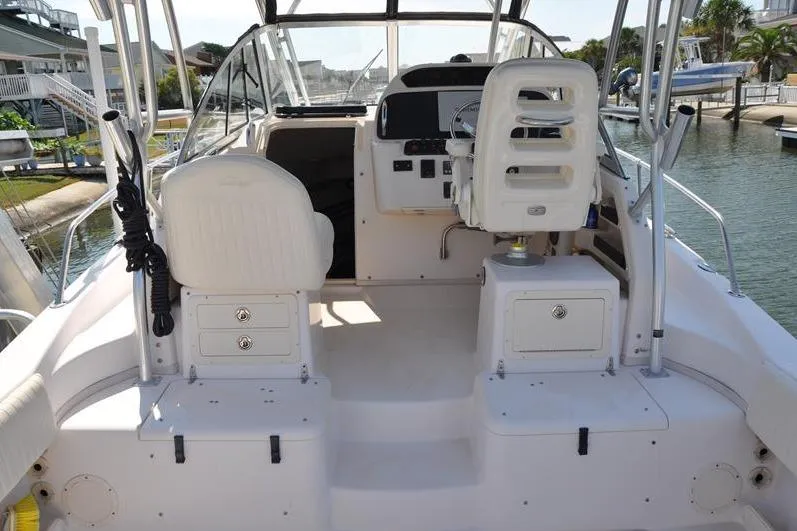 Slide: The Image of 2010 Grady-White Chesapeake 290 boat interior with helm and seating area. - 4