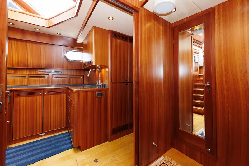 Slide: The Image of Luxurious 2009 Hunt Yachts 52 Express interior with wood paneling and cozy seating area. - 38