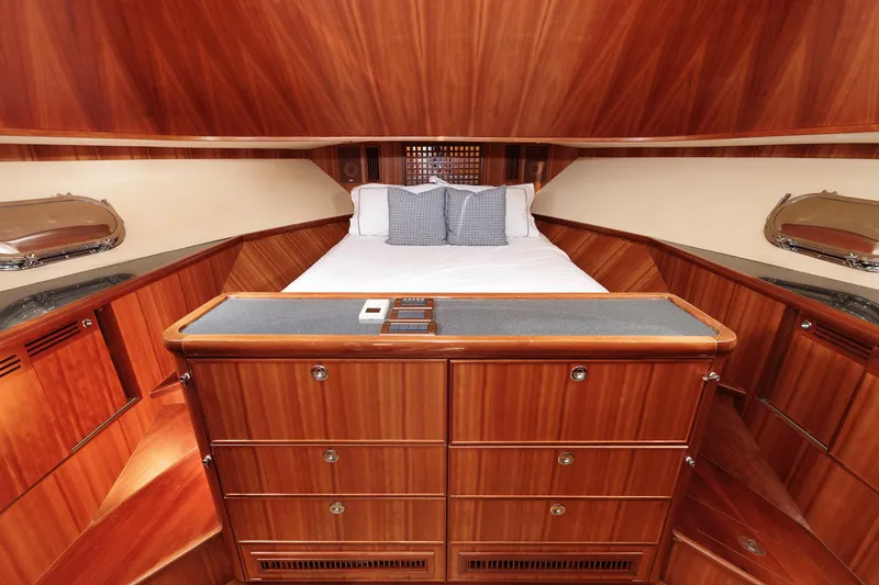 Slide: The Image of Luxurious 2009 Hunt Yachts 52 Express bathroom with wood cabinetry and glass shower. - 43