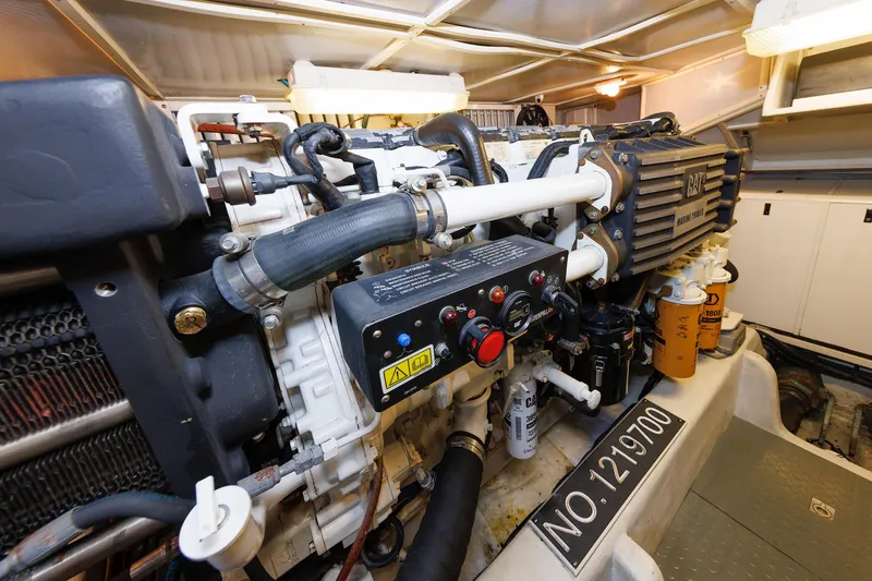 Slide: The Image of Engine room of 2009 Hunt Yachts 52 Express, showcasing mechanical components and systems. - 49