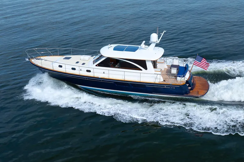 Slide: The Image of 2009 Hunt Yachts 52 Express cruising on calm waters under a clear sky. - 8