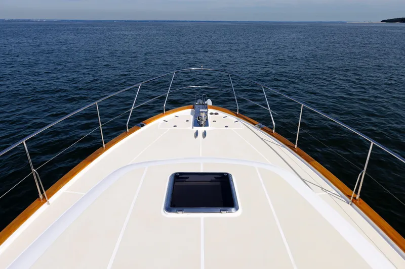 Slide: The Image of Bow view of 2009 Hunt Yachts 52 Express on calm water. - 12