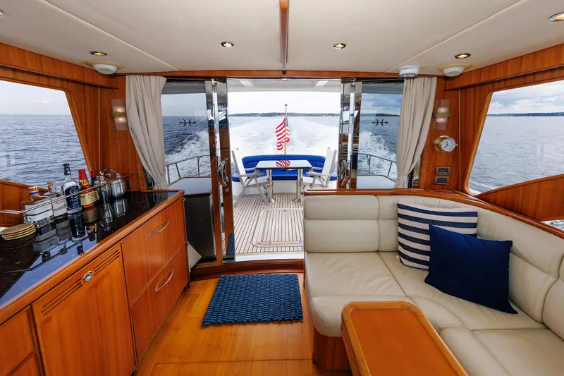 Slide: The Image of Luxurious 2009 Hunt Yachts 52 Express interior with elegant wood finish and scenic ocean view. - 24