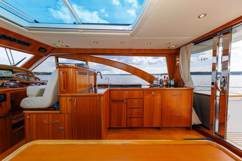 Slide: The Image of Luxurious interior of 2009 Hunt Yachts 52 Express with panoramic windows and elegant wood finish. - 28