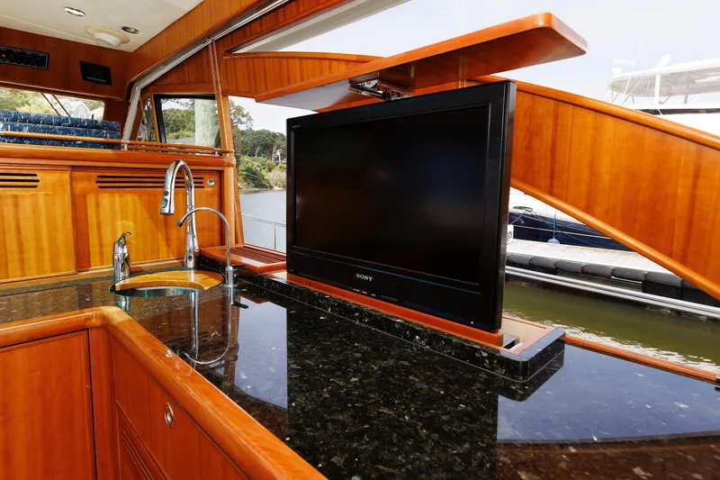 Slide: The Image of Luxurious 2009 Hunt Yachts 52 Express interior with wooden cabinetry and ocean view. - 29