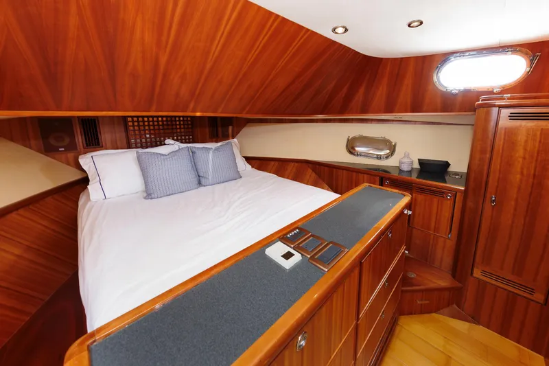 Slide: The Image of Luxurious 2009 Hunt Yachts 52 Express cabin with elegant wood finish and cozy bedding. - 45