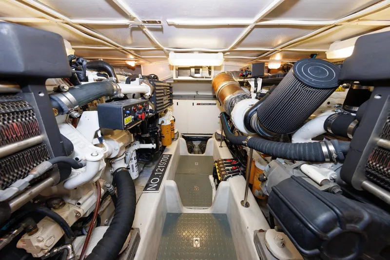 Slide: The Image of Luxurious bathroom in 2009 Hunt Yachts 52 Express, featuring wood cabinetry and modern fixtures. - 48