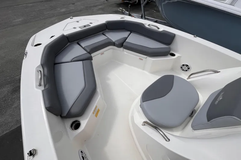Slide: The Image of 2023 NauticStar 191 Hybrid boat interior with gray cushioned seating and cup holders. - 11