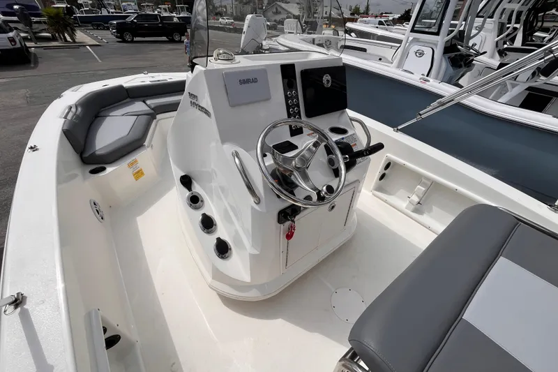 Slide: The Image of 2023 NauticStar 191 Hybrid boat interior with steering console and seating. - 12