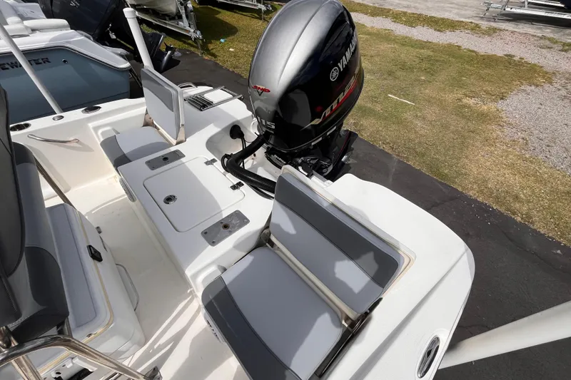 Slide: The Image of 2023 NauticStar 191 Hybrid boat with Yamaha outboard motor, featuring comfortable seating. - 14