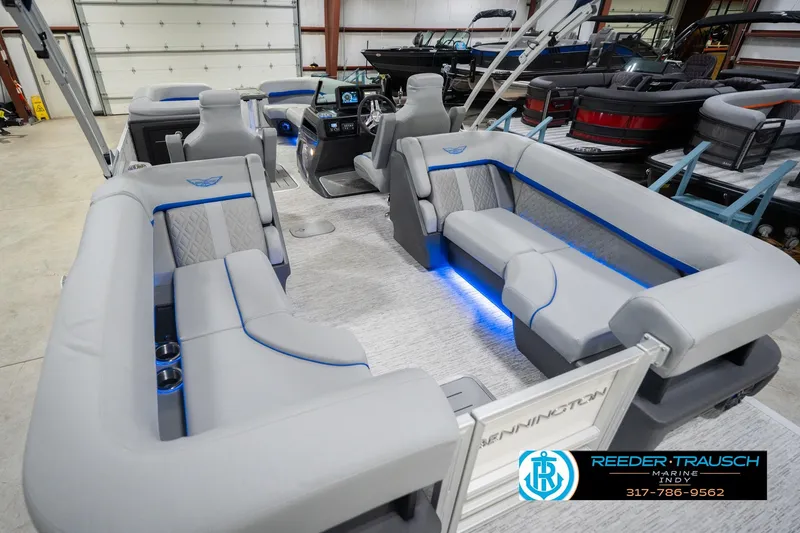 Slide: The Image of 2026 Bennington 24 MOFB pontoon boat interior with luxurious seating and ambient lighting. - 15