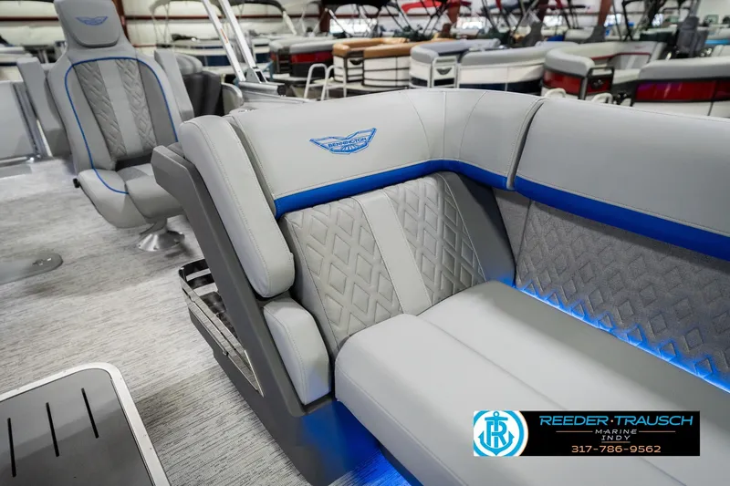 Slide: The Image of Luxurious interior of 2026 Bennington 24 MOFB pontoon boat with elegant seating. - 24