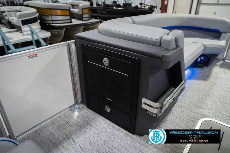 Slide: The Image of 2026 Bennington 24 MOFB pontoon boat interior with sleek seating and storage. - 26
