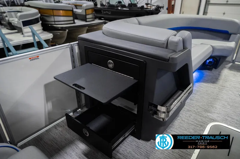 Slide: The Image of 2026 Bennington 24 MOFB boat interior with storage compartments and seating. - 28