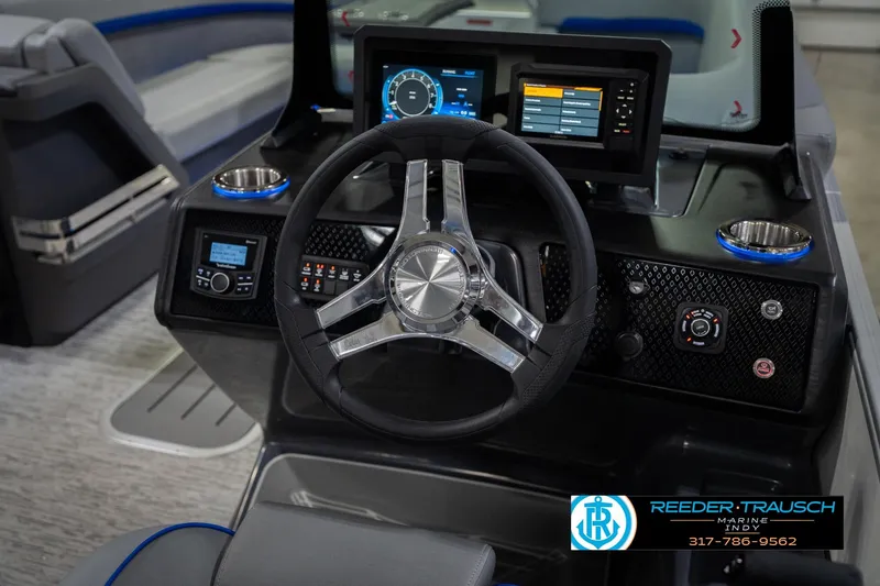 Slide: The Image of 2026 Bennington 24 MOFB boat dashboard with steering wheel and digital displays. - 35
