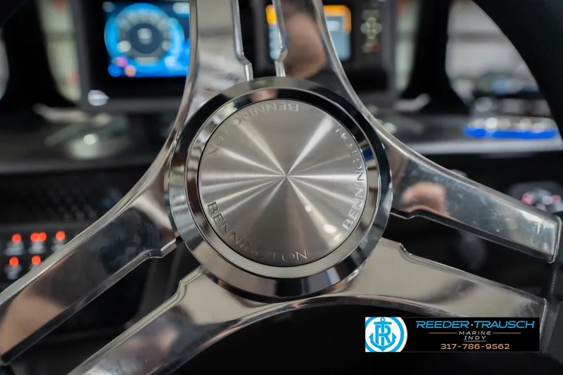 Slide: The Image of Steering wheel of 2026 Bennington 24 MOFB boat with modern dashboard display. - 37
