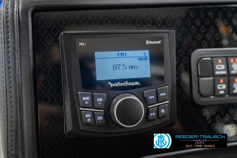 Slide: The Image of 2026 Bennington 24 MOFB boat stereo system with Bluetooth and FM radio display. - 38