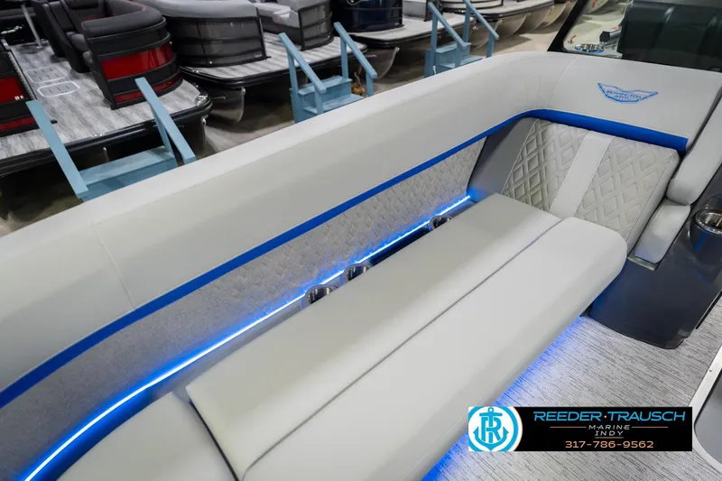 Slide: The Image of Luxurious seating on 2026 Bennington 24 MOFB boat with blue LED lighting. - 48