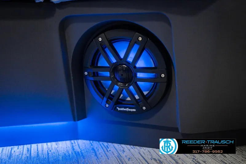 Slide: The Image of Blue-lit speaker on 2026 Bennington 24 MOFB boat, featuring Rockford Fosgate audio system. - 49