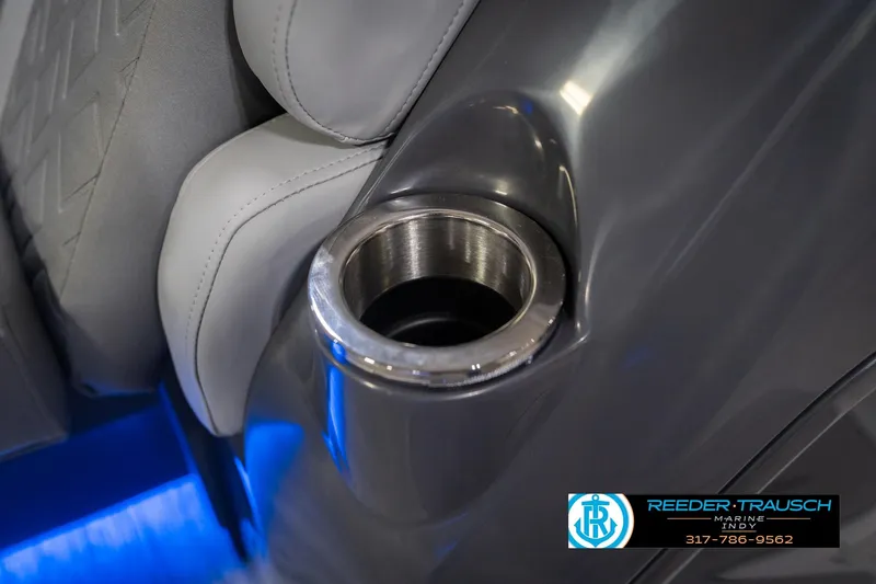 Slide: The Image of 2026 Bennington 24 MOFB boat interior with cup holder and blue LED lighting. - 52