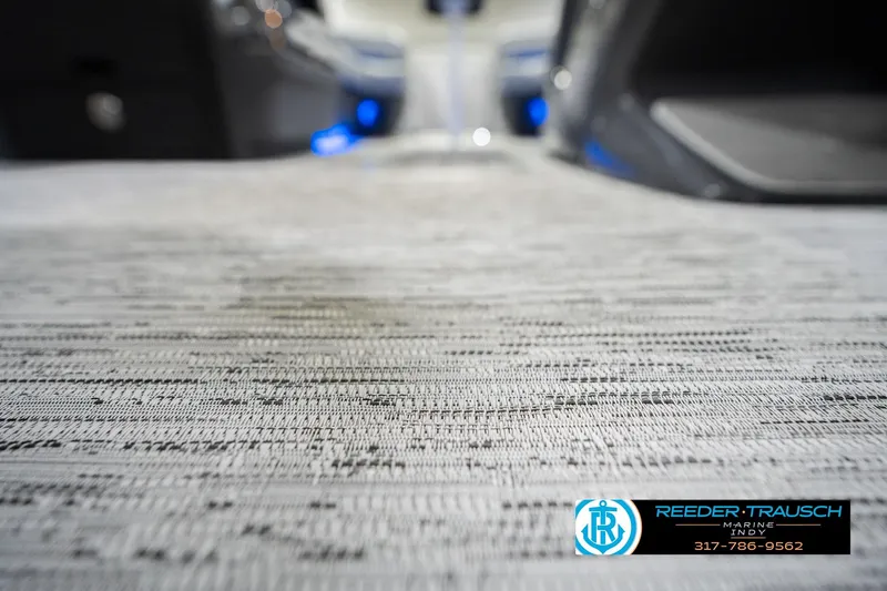 Slide: The Image of Close-up of 2026 Bennington 24 MOFB boat flooring with Reeder-Trausch Marine logo. - 53