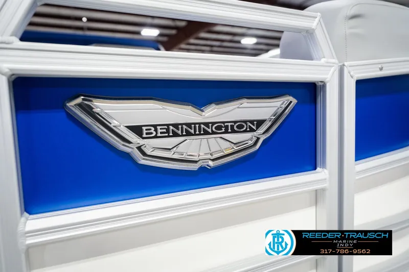 Slide: The Image of 2026 Bennington 24 MOFB boat logo with blue and white design, Reeder-Trausch Marine contact. - 54