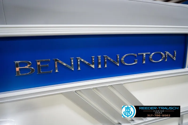 Slide: The Image of 2026 Bennington 24 MOFB boat logo on blue background, Reeder-Trausch Marine contact. - 55