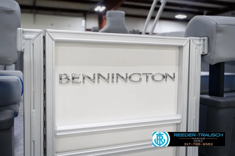Slide: The Image of 2026 Bennington 24 MOFB boat interior with logo, showcased at Reeder Trausch Marine. - 63