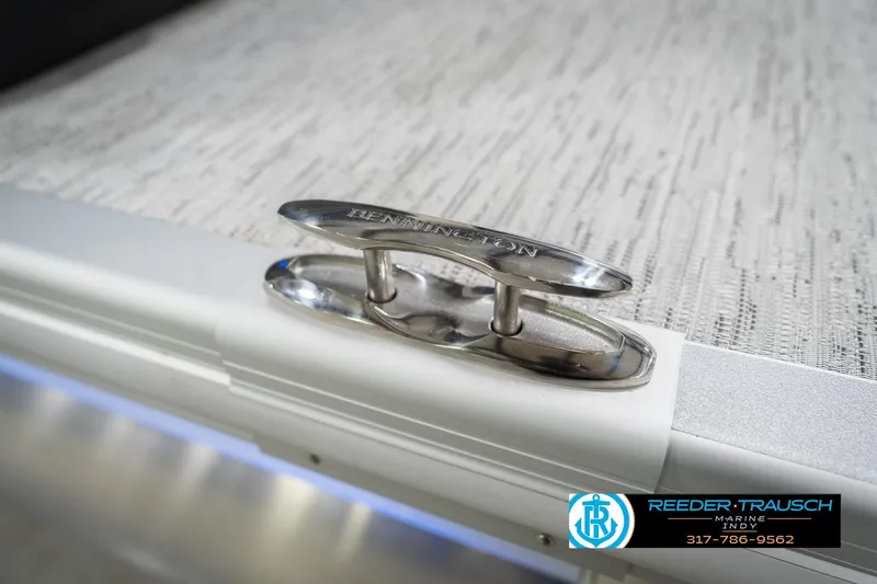 Slide: The Image of Stainless steel cleat on 2026 Bennington 24 MOFB boat deck, Reeder Trausch Marine logo visible. - 67