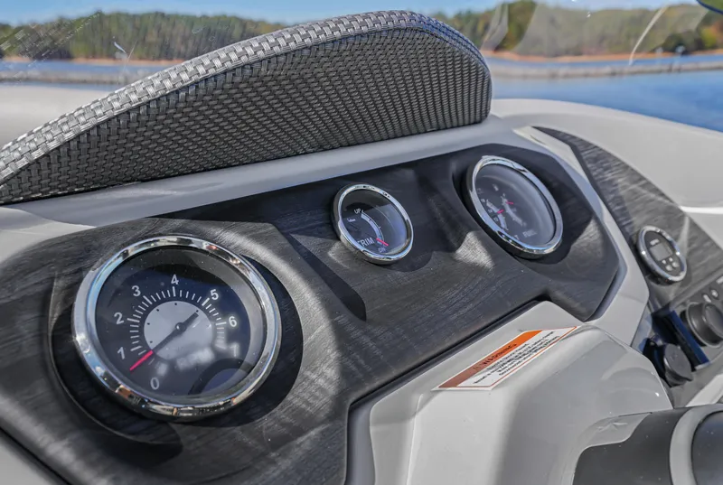 Slide: The Image of Dashboard of 2021 Crest Classic DLX 220 SLRC boat with gauges and controls. - 23