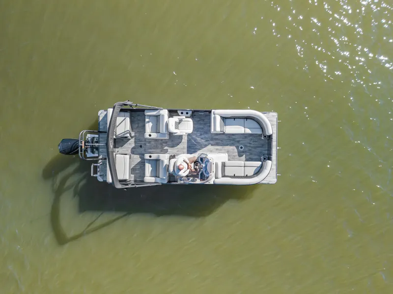 Slide: The Image of Aerial view of 2021 Crest Classic DLX 220 SLRC pontoon boat on water. - 6