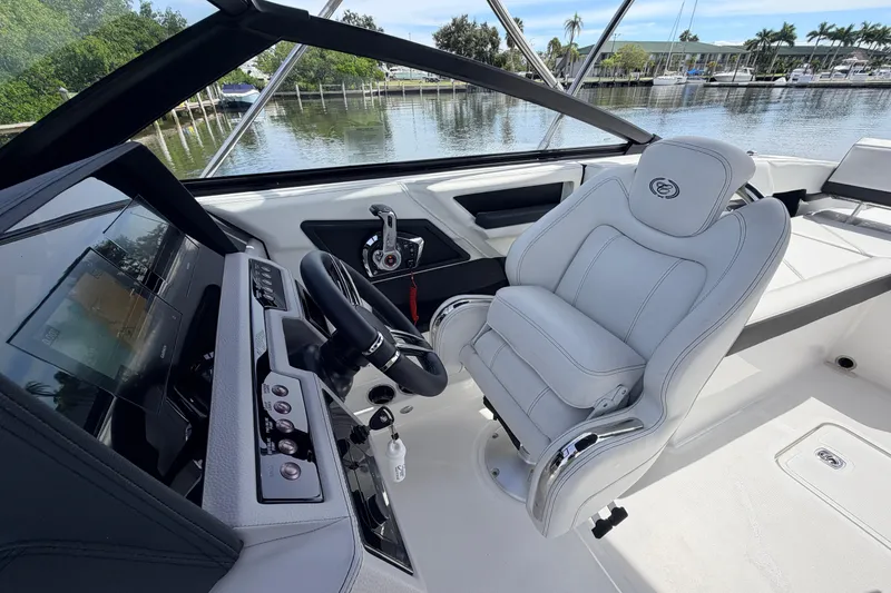 Slide: The Image of 2026 Cobalt R6 Outboard boat interior with sleek helm and luxurious captain's chair. - 14