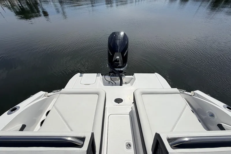 Slide: The Image of 2026 Cobalt R6 Outboard boat with sleek seating and powerful engine on calm water. - 9