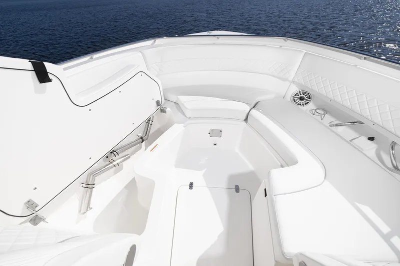 Slide: The Image of Manufacturer Provided Image: 2025 Pursuit DC 326 Dual Console boat interior with white seating and open storage. - 5