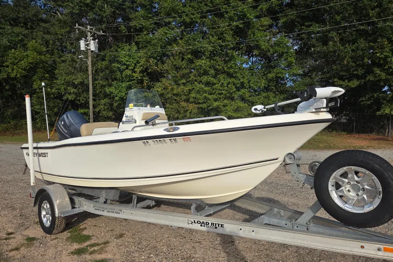 The Image of 2016 Key West 176 Center Console boat on trailer, parked outdoors. - 0