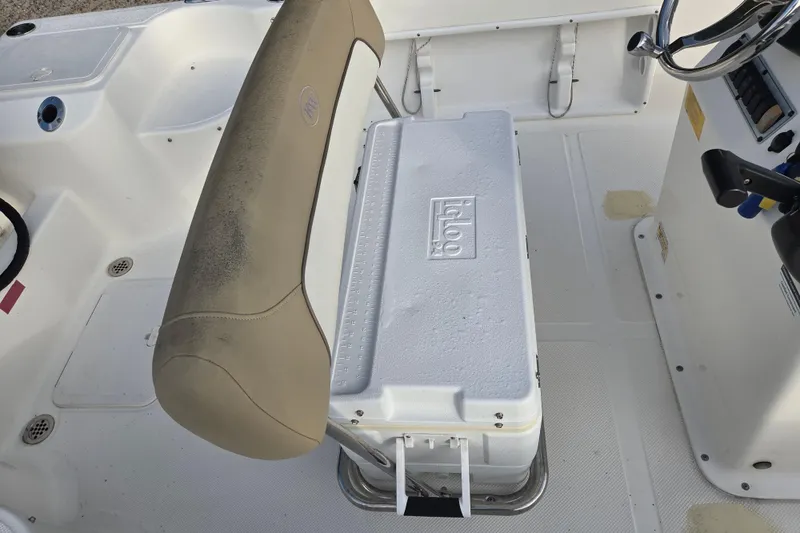 Slide: The Image of Interior of 2016 Key West 176 Center Console with Igloo cooler and beige seat. - 12