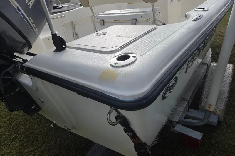Slide: The Image of 2016 Key West 176 Center Console boat rear view with motor and trailer. - 5