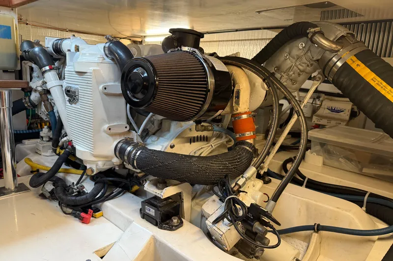 Slide: The Image of Engine room of 2008 Legacy Yachts 42 Extended Hardtop Flybridge, showcasing mechanical components. - 38