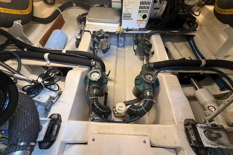 Slide: The Image of Engine room of 2008 Legacy Yachts 42, showcasing mechanical components and piping. - 39