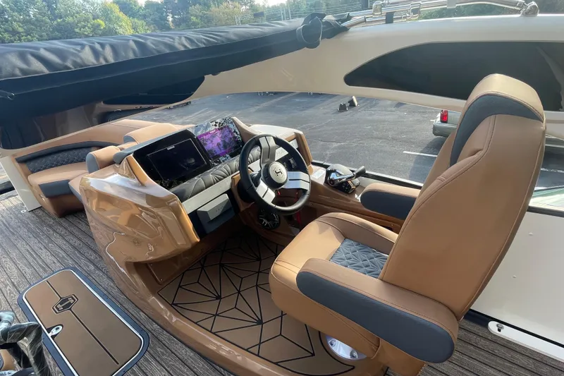 Slide: The Image of 2026 Harris Grand Mariner 230 SLDH boat interior with modern helm and luxurious seating. - 14