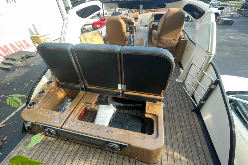 Slide: The Image of 2026 Harris Grand Mariner 230 SLDH boat interior with seating and storage compartments. - 15