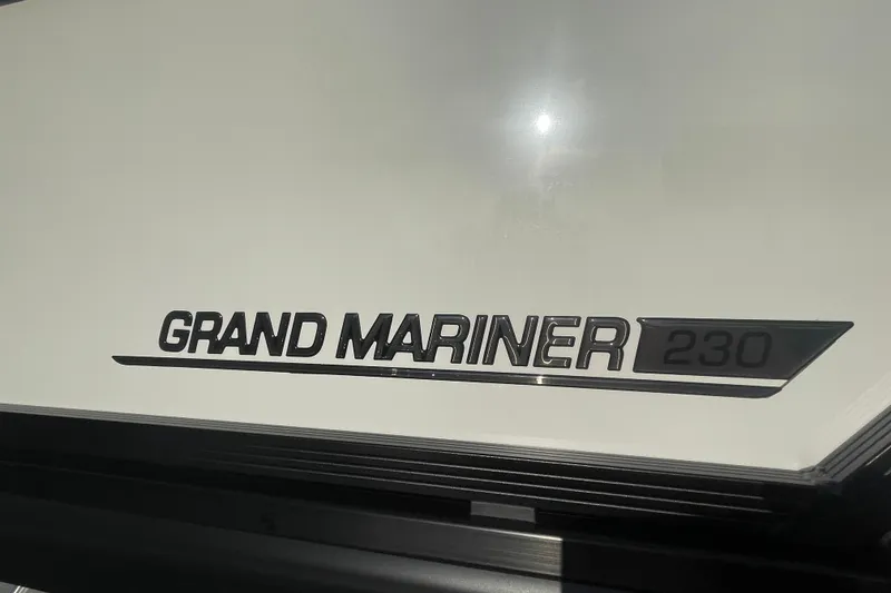 Slide: The Image of 2026 Harris Grand Mariner 230 SLDH logo on a sleek white surface. - 4